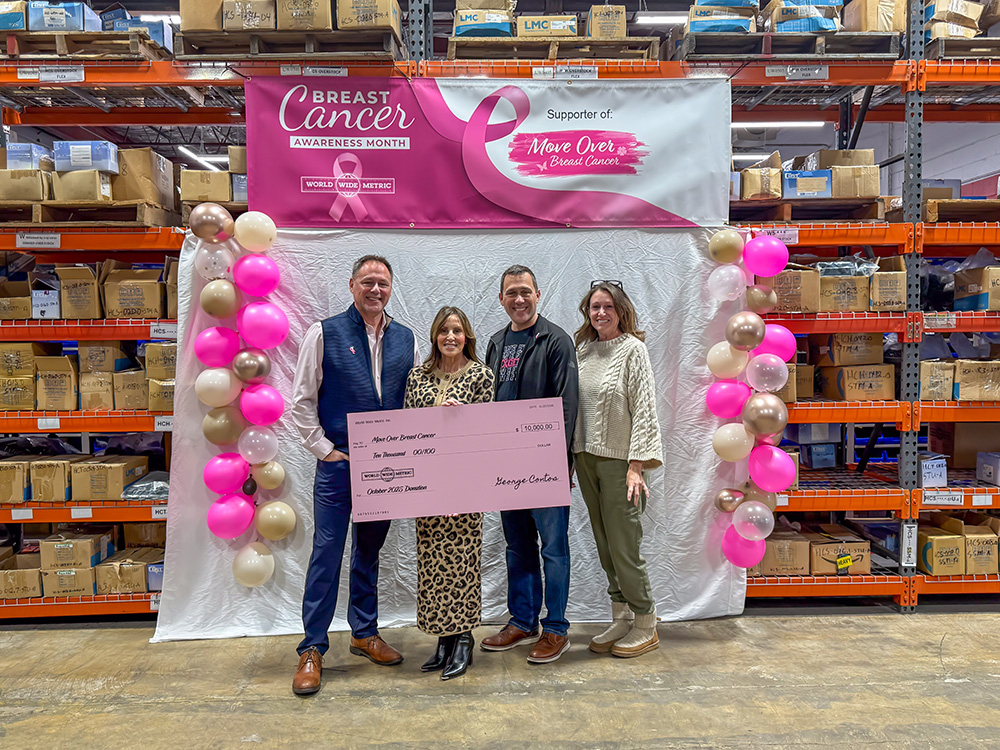 Group presenting a donation check to Move Over Breast Cancer during Breast Cancer Awareness Month